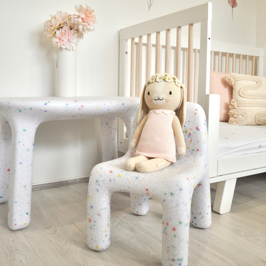 White Confetti Set with Bunny on chair in floral theme kids room, cropped image