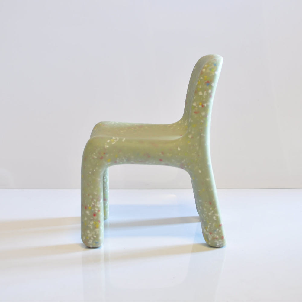 Green speckles confetti kids chair on a white background