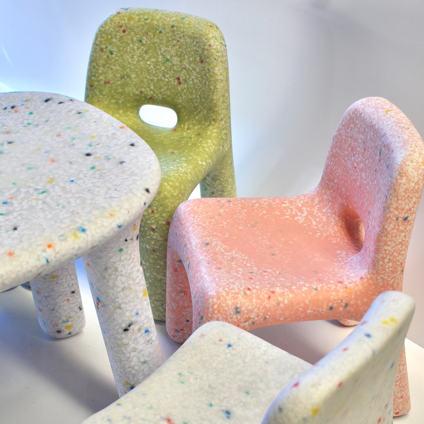 confetti table 3 chairs white pink and green on studio background portrait orientation