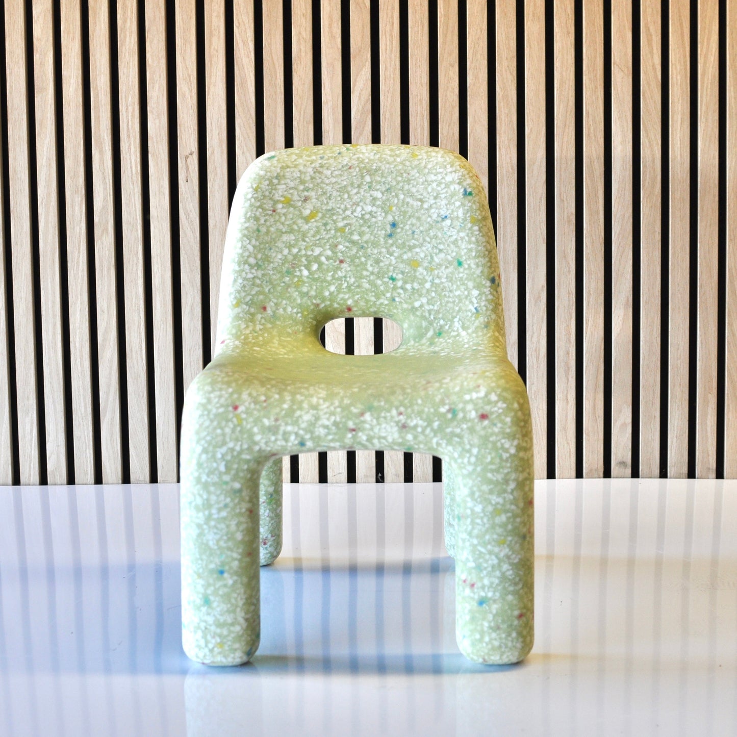 speckles kids matcha confetti chair green front view on veneer background