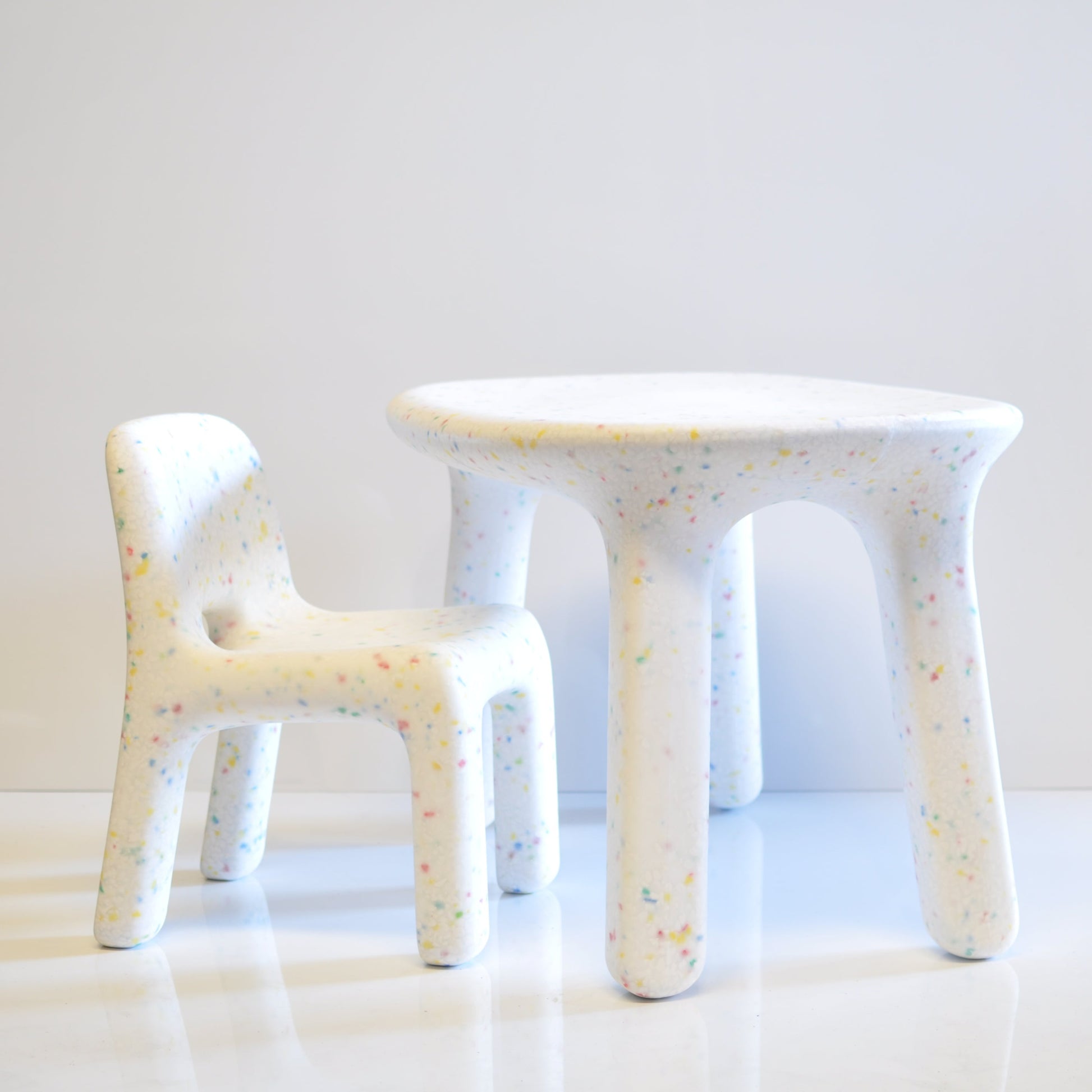children's White speckles confetti chair and table set on a white background