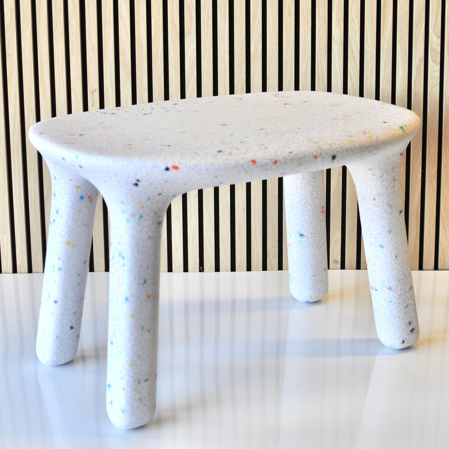 speckles kids white confetti table angled view with veneer background