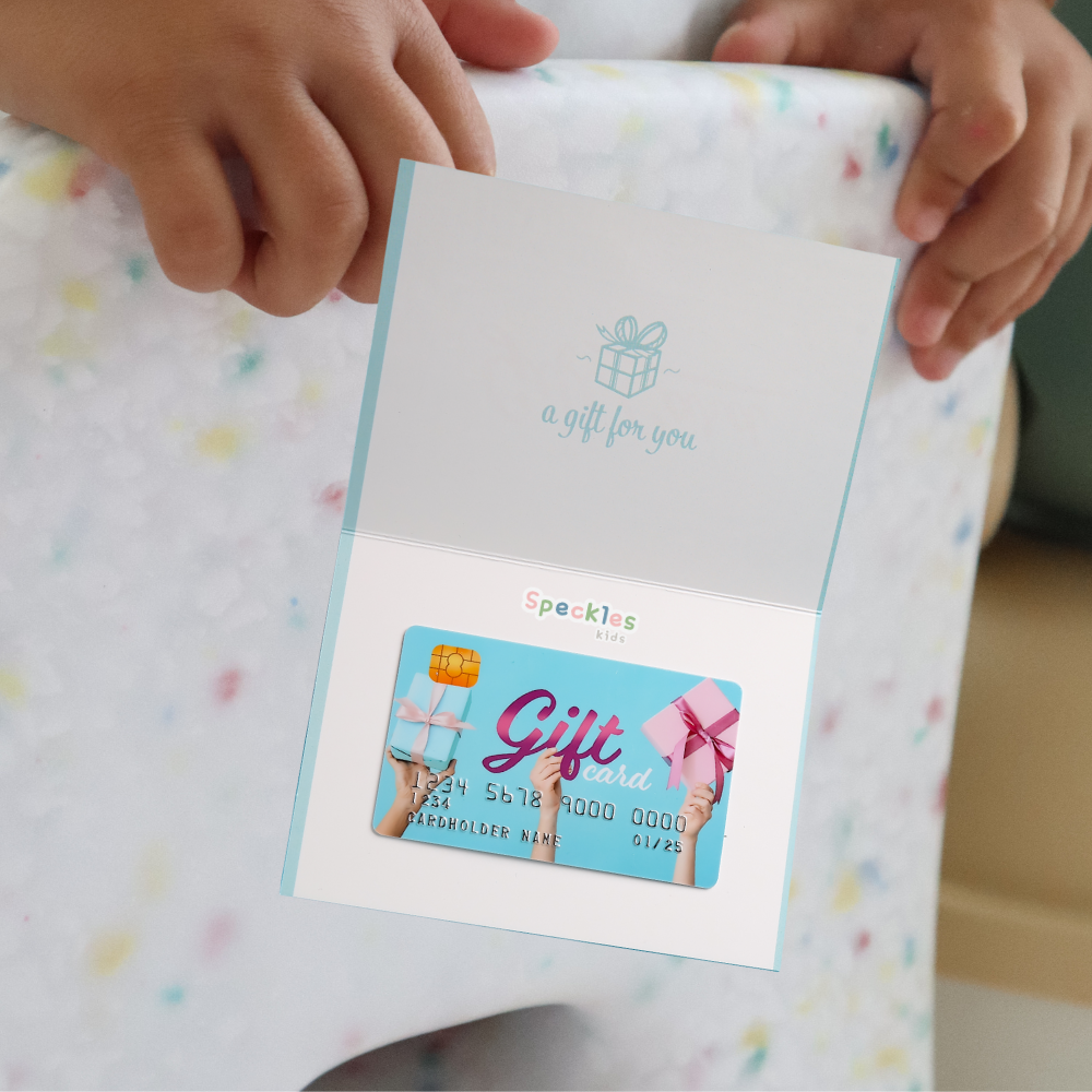 Speckles kids Giftcard on a confetti pattern background