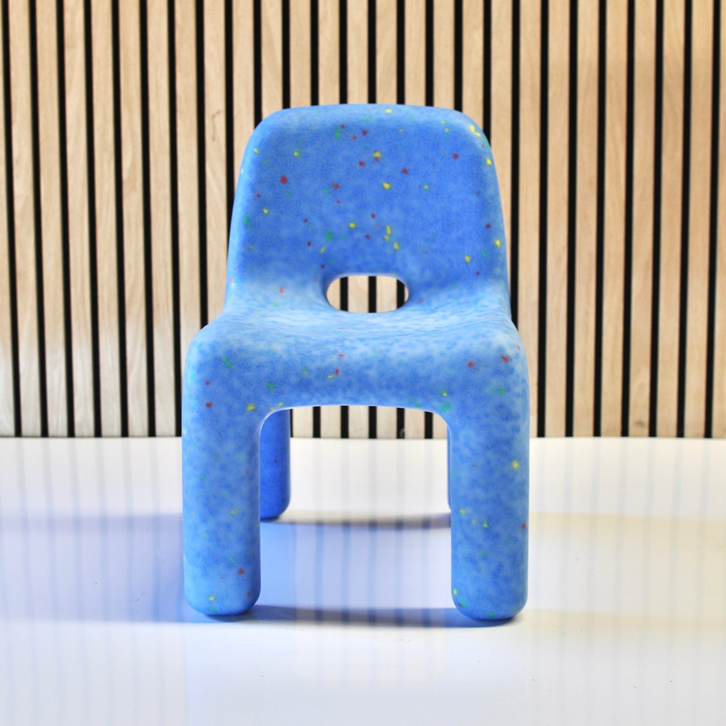 speckles kids ocean confetti chair blue front view on veneer background