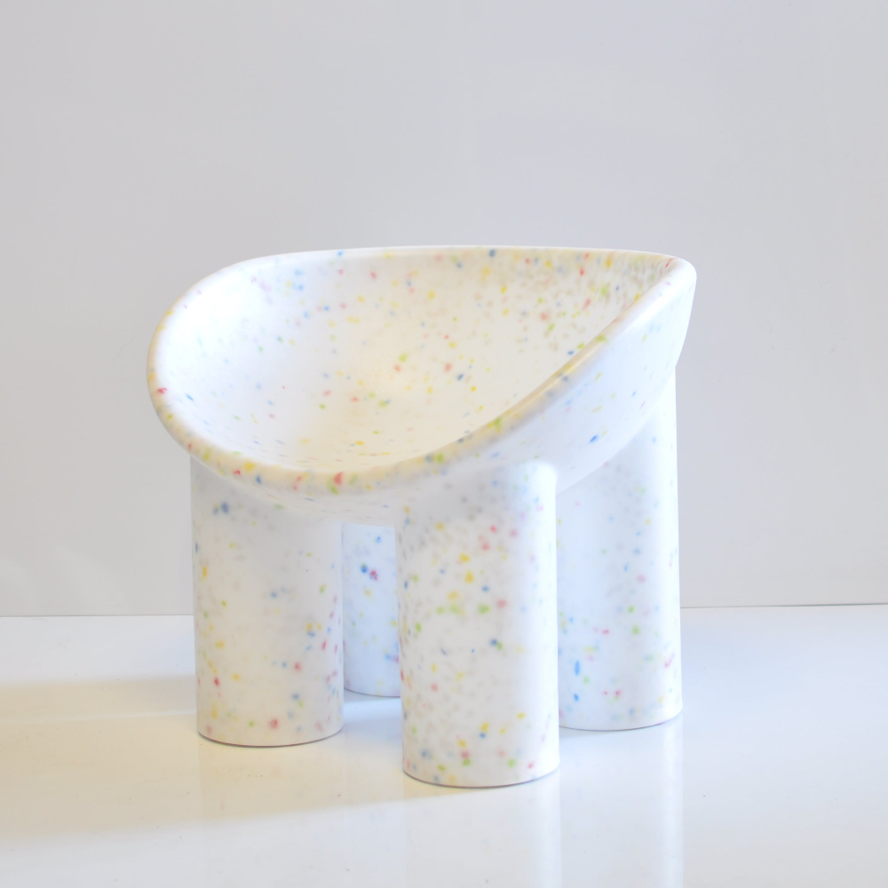 white kids confetti roly poly chair on a white background